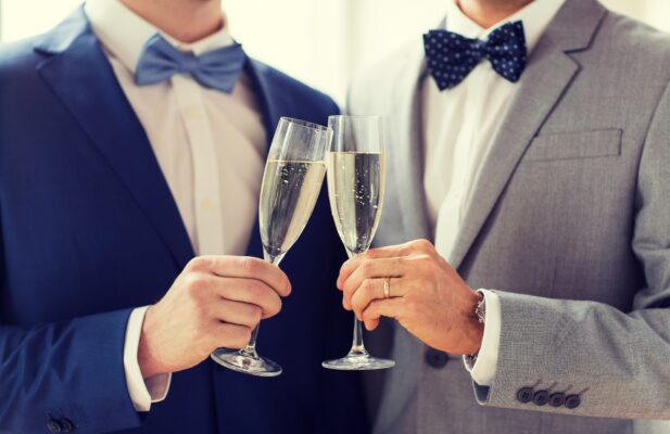 Close,Up,Of,Male,Gay,Couple,With,Champagne,Glasses